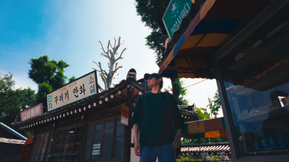 Ben exploring a street in Asia, captured on film
