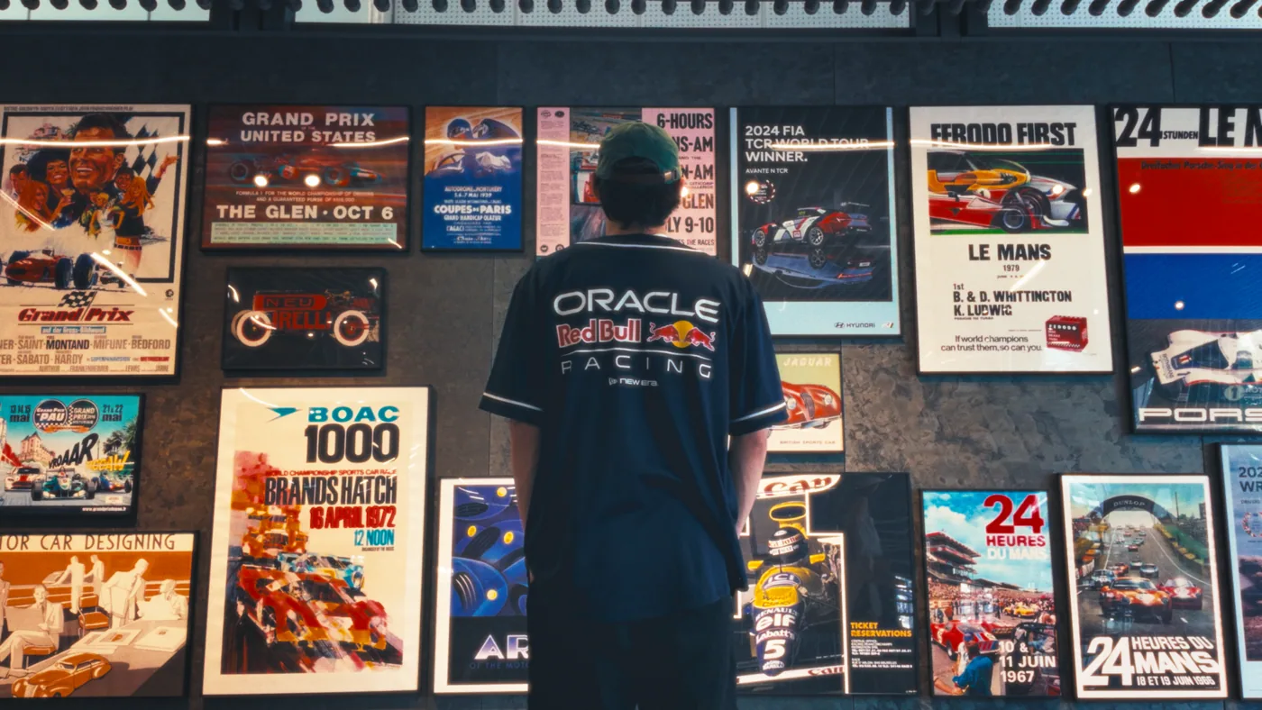 Ben looking at a wall of racing posters