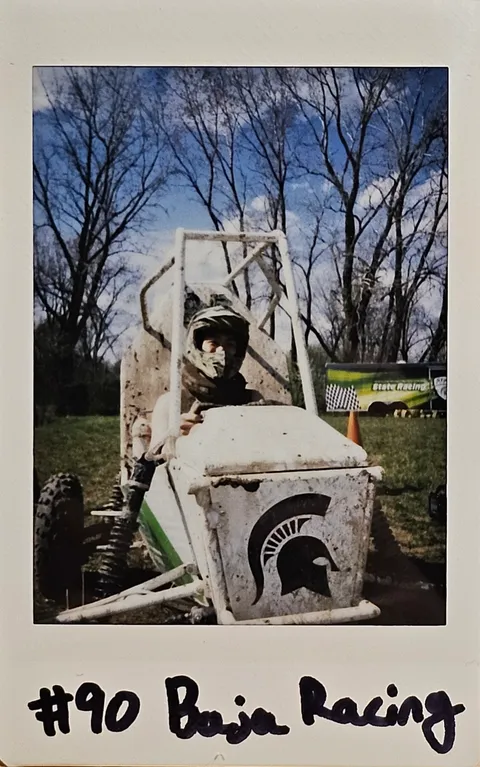 An instant photo of the Baja car on a trail